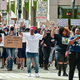 Participants in a march for the Black Lives Matter movement raise their arms as they make their way along the Boulevard of the Allies, Saturday, June 13, 2020, in downtown Pittsburgh.